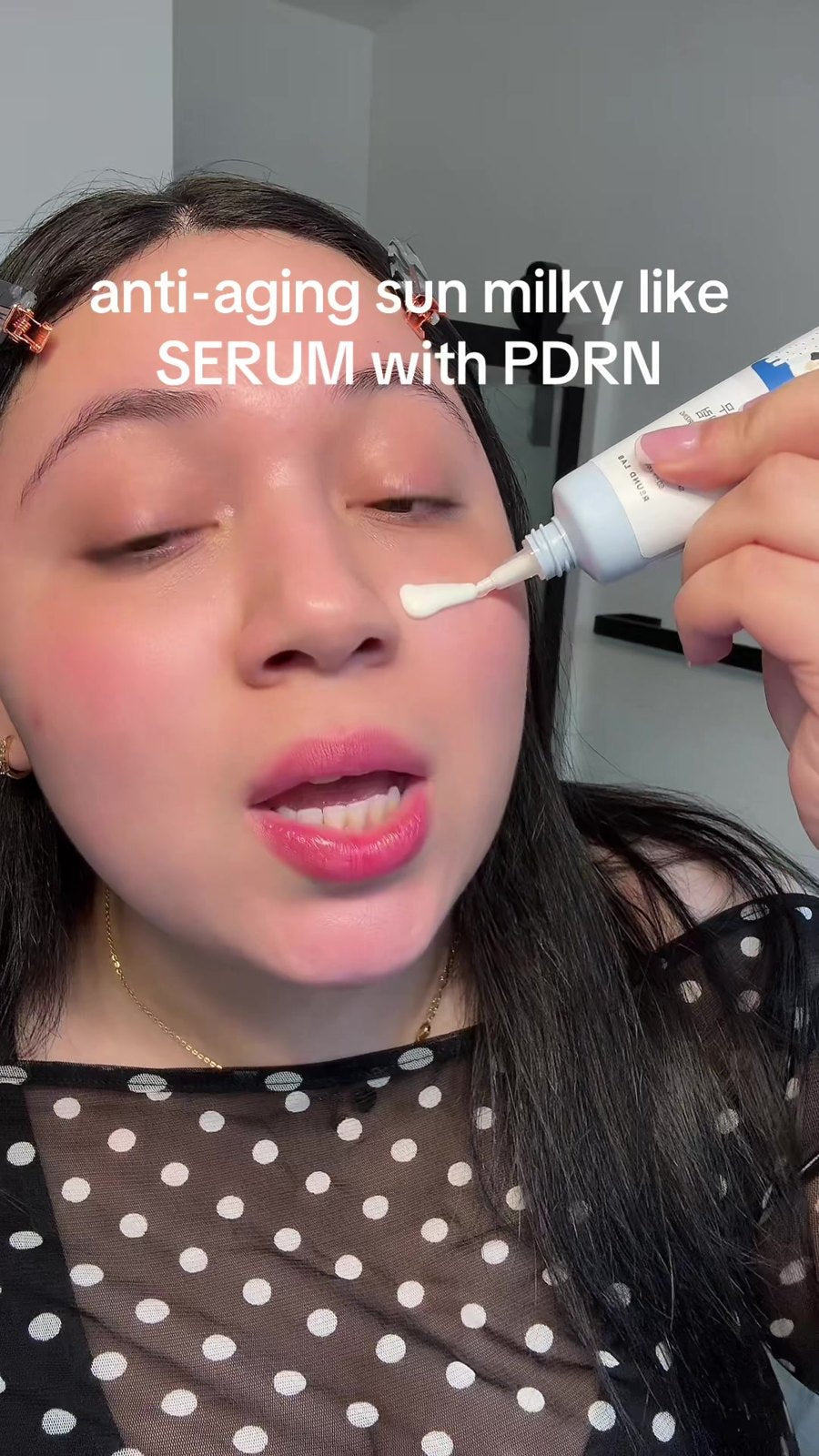 Smoothing the anti-aging serum around the eye area