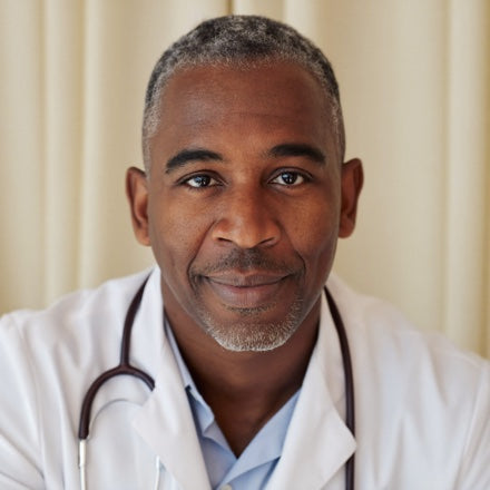A general practitioner in a white coat